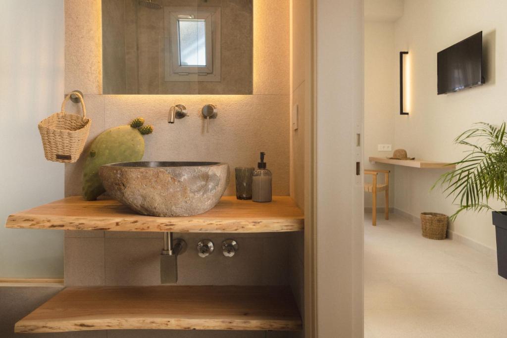 a bathroom with a bowl on a wooden counter at Sea View in Laganas