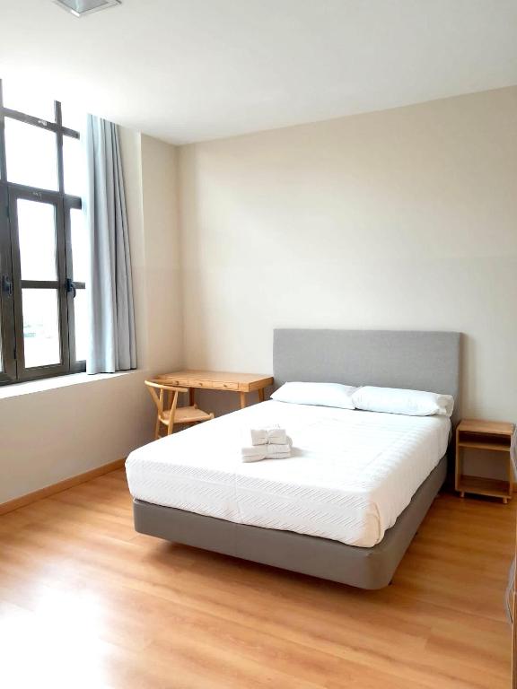 Cama o camas de una habitación en Tres Estrellas Camí de Sirga Mequinenza