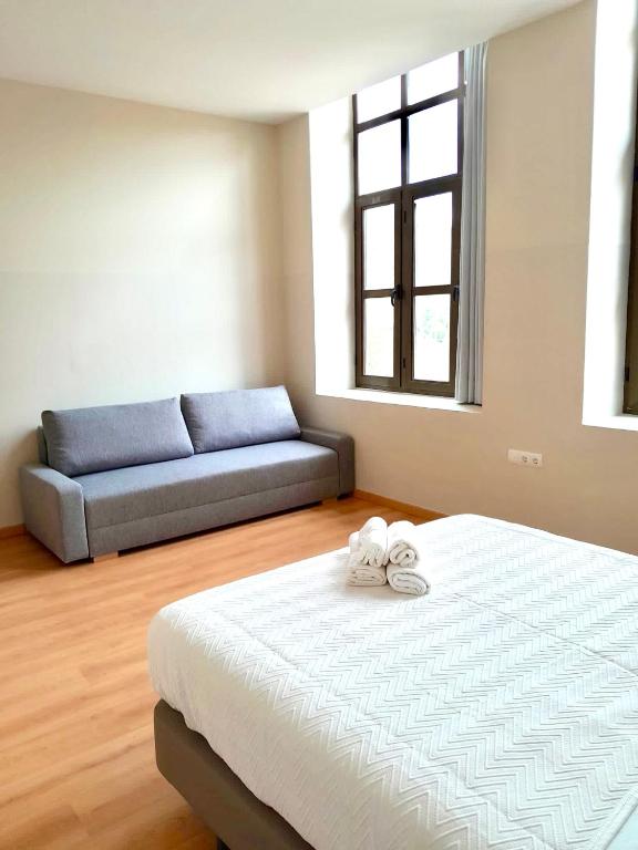 Cama o camas de una habitación en Tres Estrellas Camí de Sirga Mequinenza