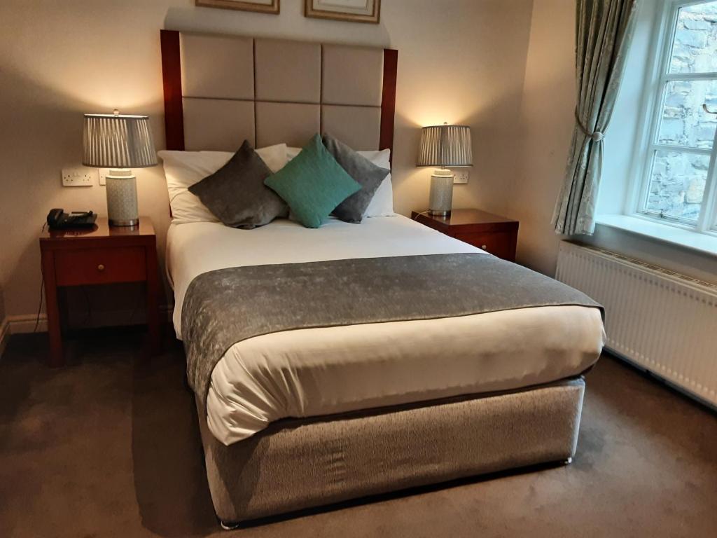 Ένα ή περισσότερα κρεβάτια σε δωμάτιο στο Leixlip Manor Hotel
