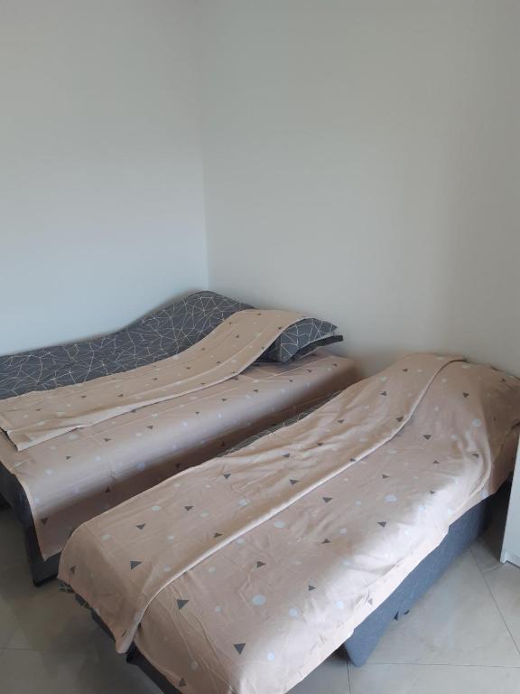 Postel nebo postele na pokoji v ubytování Apartments Mušović