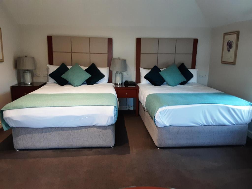 Ένα ή περισσότερα κρεβάτια σε δωμάτιο στο Leixlip Manor Hotel