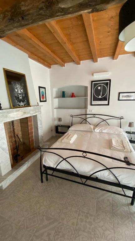 Ein Bett oder Betten in einem Zimmer der Unterkunft B&B Gronda Via Vandelli