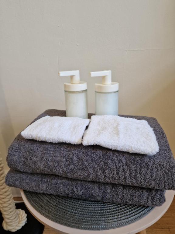 a pile of towels sitting on top of a table at London Cozy Stay in London