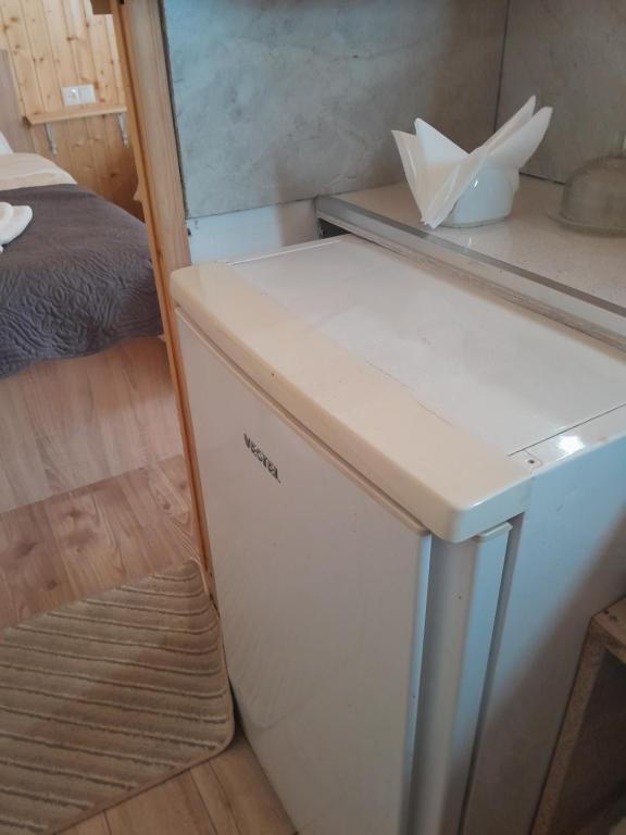 Kuchyň nebo kuchyňský kout v ubytování Cozy apartament