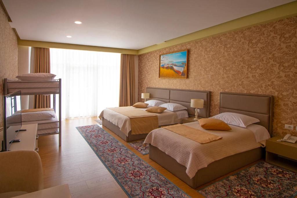 Postel nebo postele na pokoji v ubytování NBT Hotel Reps