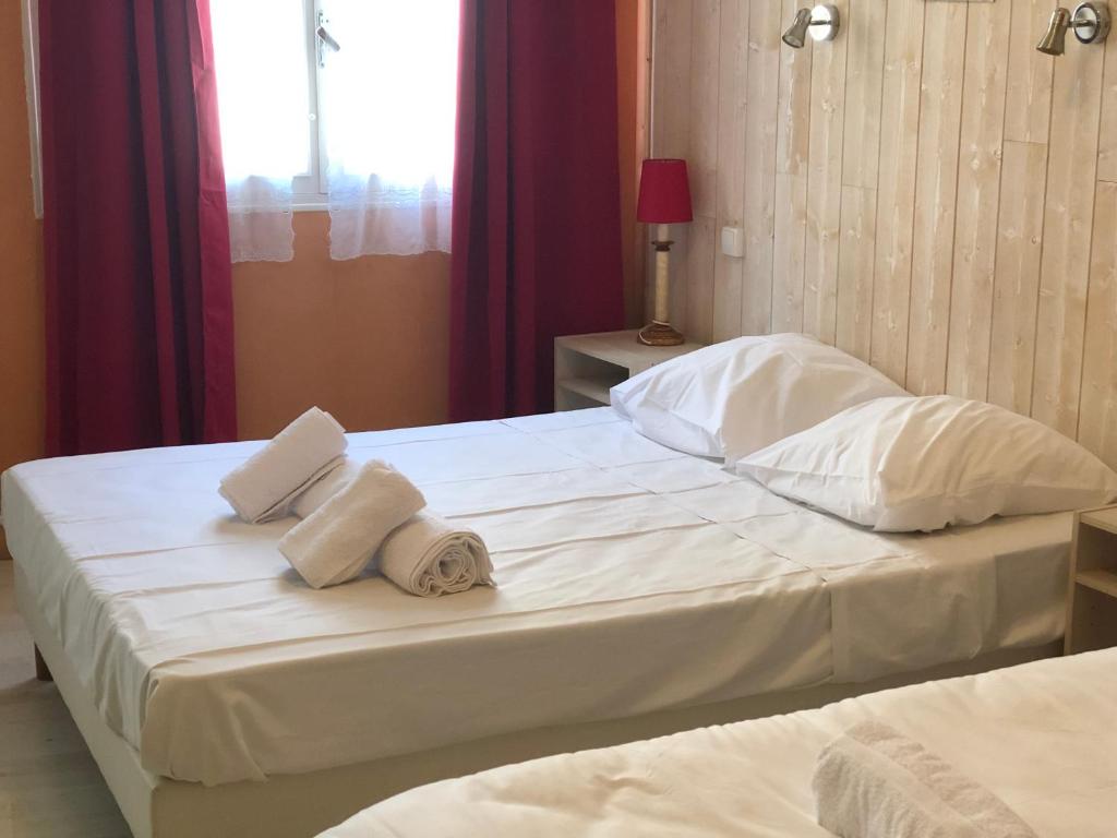 Postel nebo postele na pokoji v ubytování Hotel François 1Er