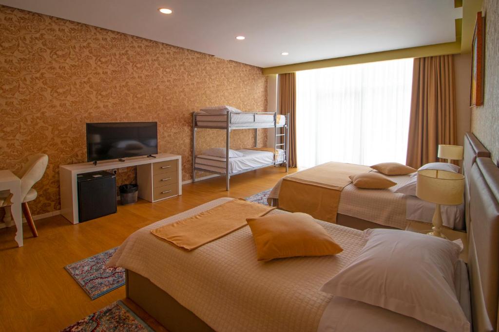 Postel nebo postele na pokoji v ubytování NBT Hotel Reps