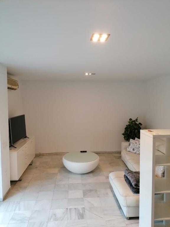 TV a/nebo společenská místnost v ubytování Casa con piscina privada