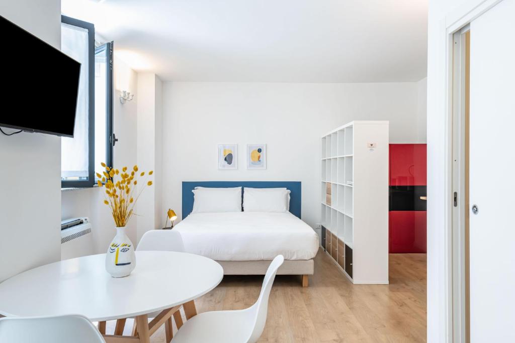 Ένα ή περισσότερα κρεβάτια σε δωμάτιο στο RELSTAY - Porta Romana - Large Studio