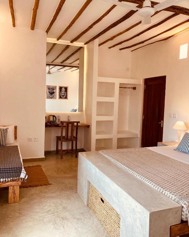 Postel nebo postele na pokoji v ubytování Pucci House Watamu