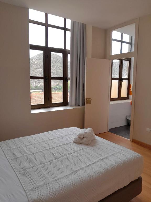 Cama o camas de una habitación en Tres Estrellas Camí de Sirga Mequinenza