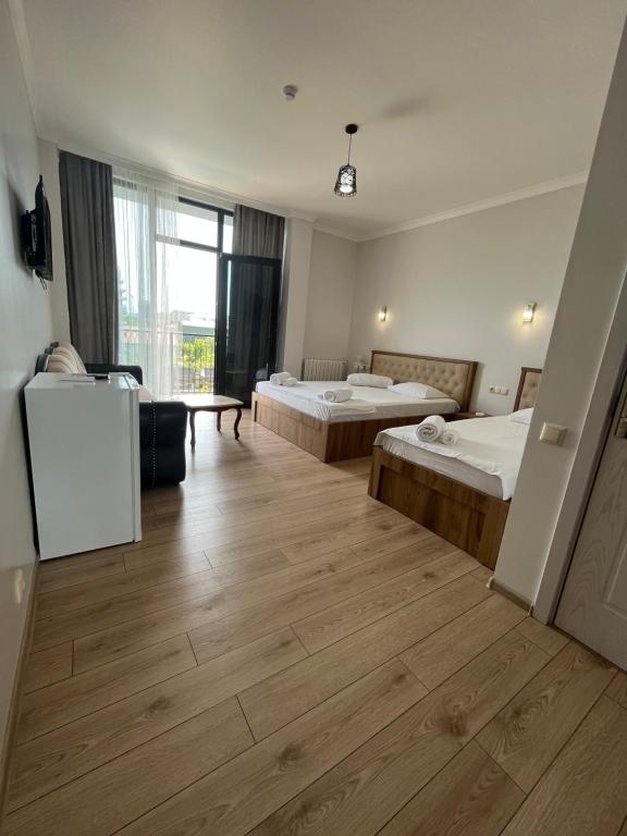 Postel nebo postele na pokoji v ubytování Cozy Rooms