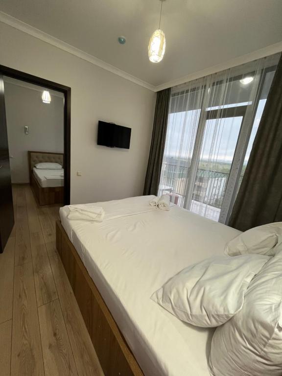 Postel nebo postele na pokoji v ubytování Cozy Rooms