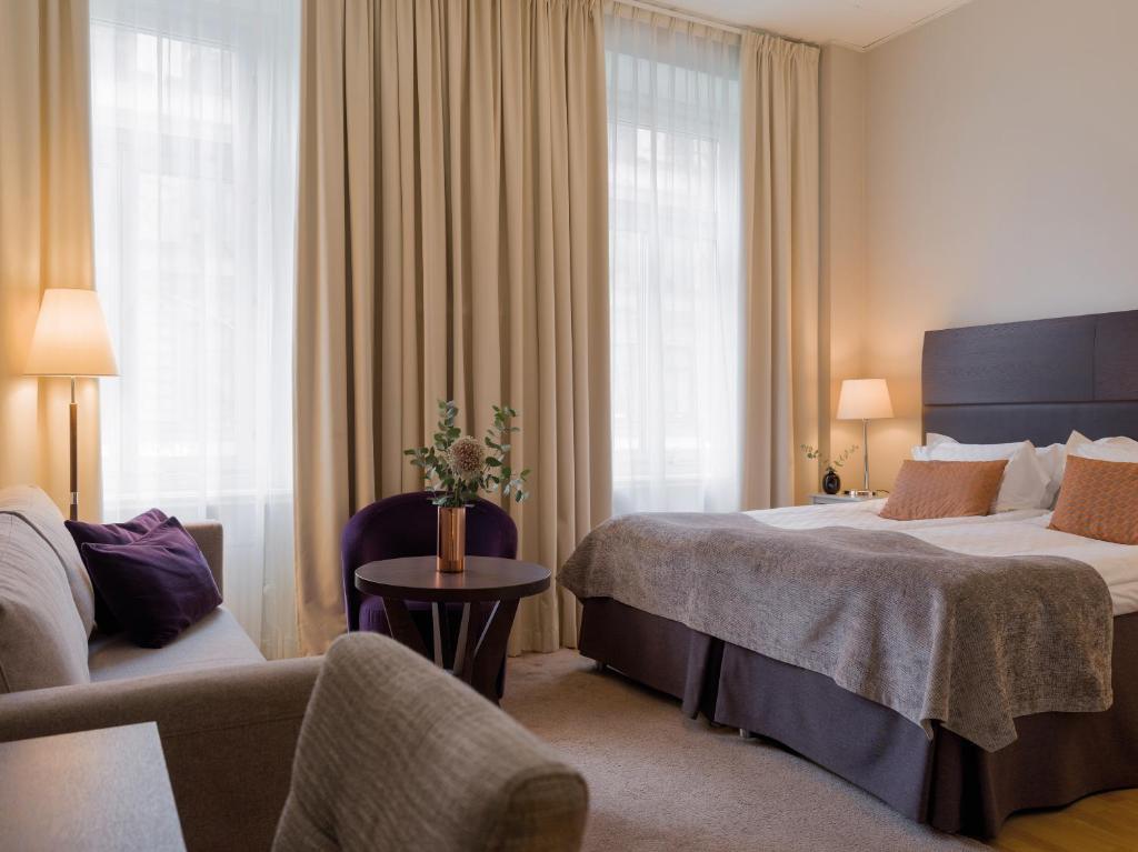 Postel nebo postele na pokoji v ubytování Elite Hotel Adlon