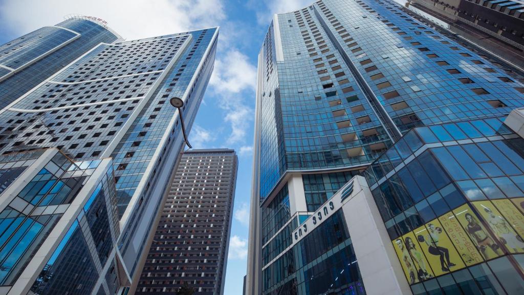 a group of tall buildings in a city at New Wave Hotel in Batumi