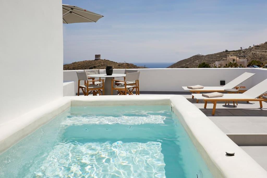 a pool on the roof of a house at Lerion Luxury Villas in Akrotiri