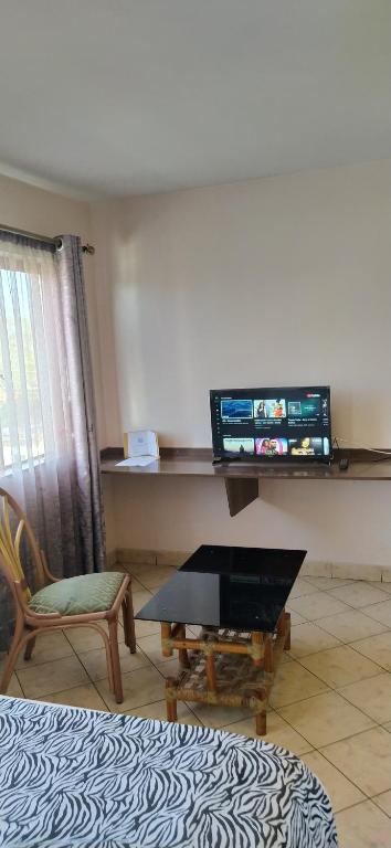 TV a/nebo společenská místnost v ubytování Plus254 Hotel
