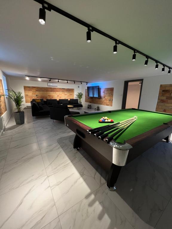 a living room with a pool table in it at Kierunek Górki 