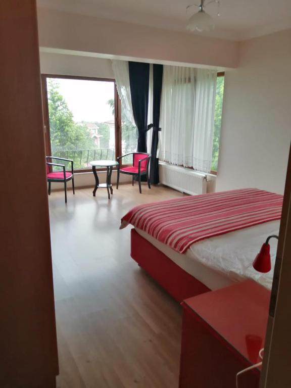 Кровать или кровати в номере SNOW HİLL HOUSE Pansiyon