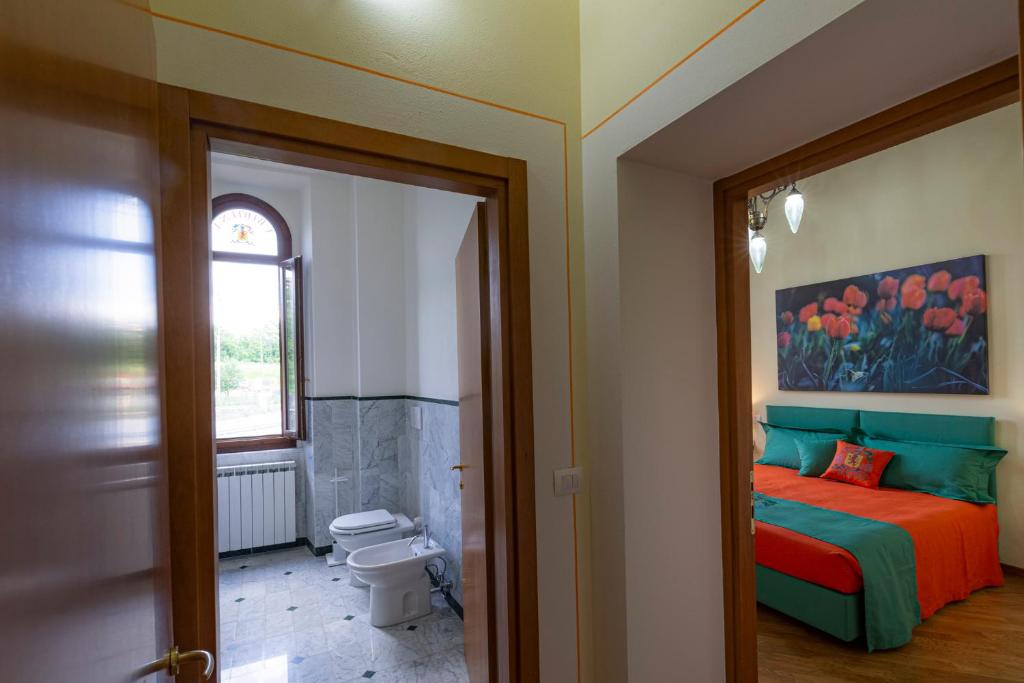 Postel nebo postele na pokoji v ubytování IBibiena - CASA CAMPALDINO