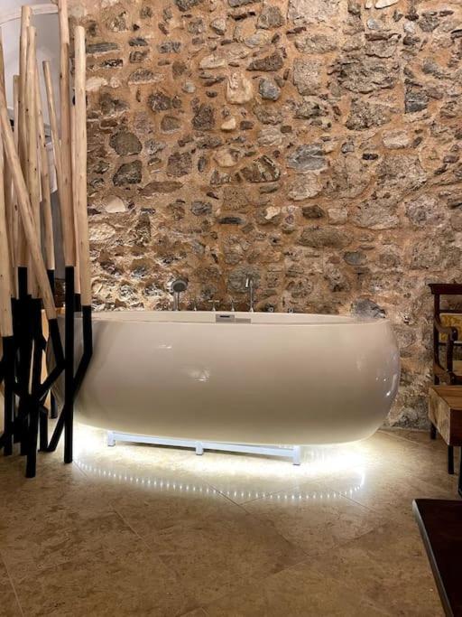 LIVING IN A CAVE UNDER ACROPOLIS