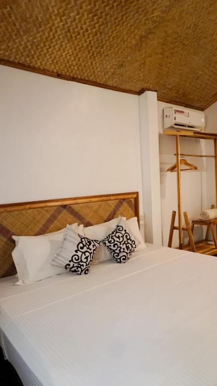 Postel nebo postele na pokoji v ubytování La Colonial Resort