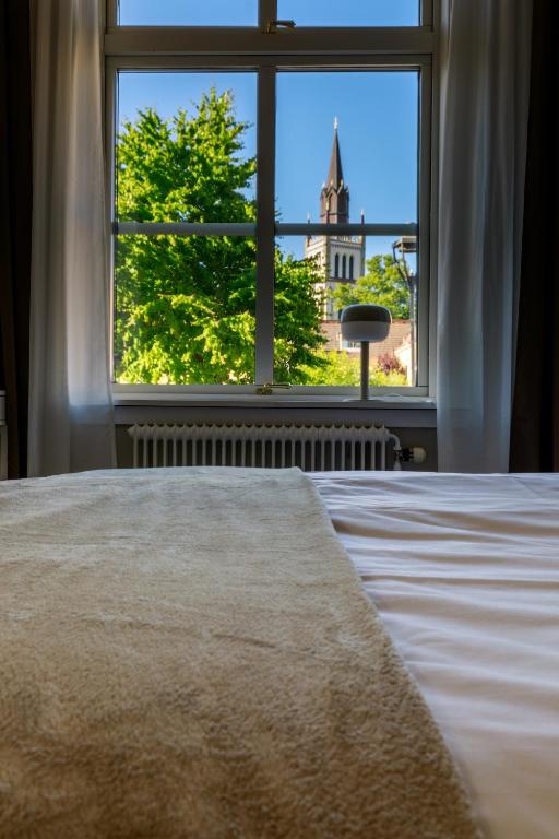 Postel nebo postele na pokoji v ubytování Nicolai B&B