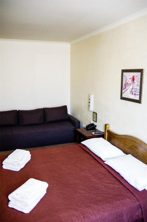 Postel nebo postele na pokoji v ubytování Hotel Marinara