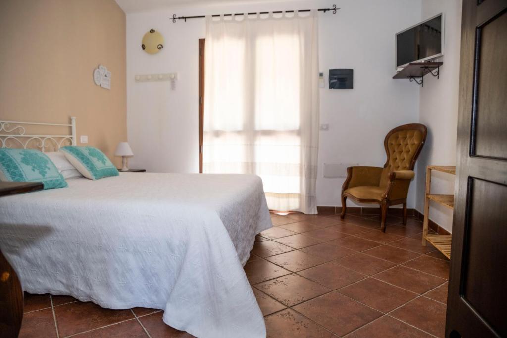 Postel nebo postele na pokoji v ubytování Agriturismo Sa Mendhula