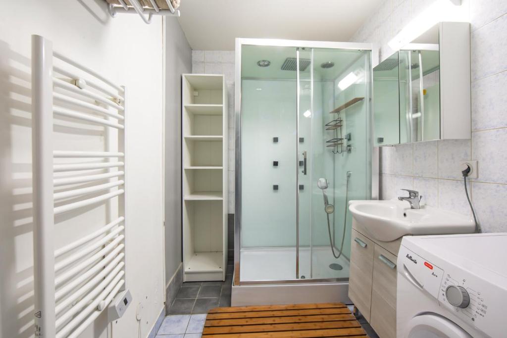 a bathroom with a shower and a sink at Charming 2br a 2 steps from the Stade de France - Welkeys in Saint-Denis