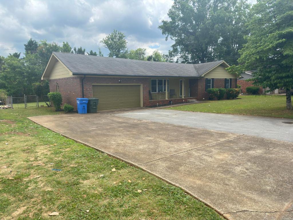 a house with a driveway in front of it at Brookwood in Chattanooga