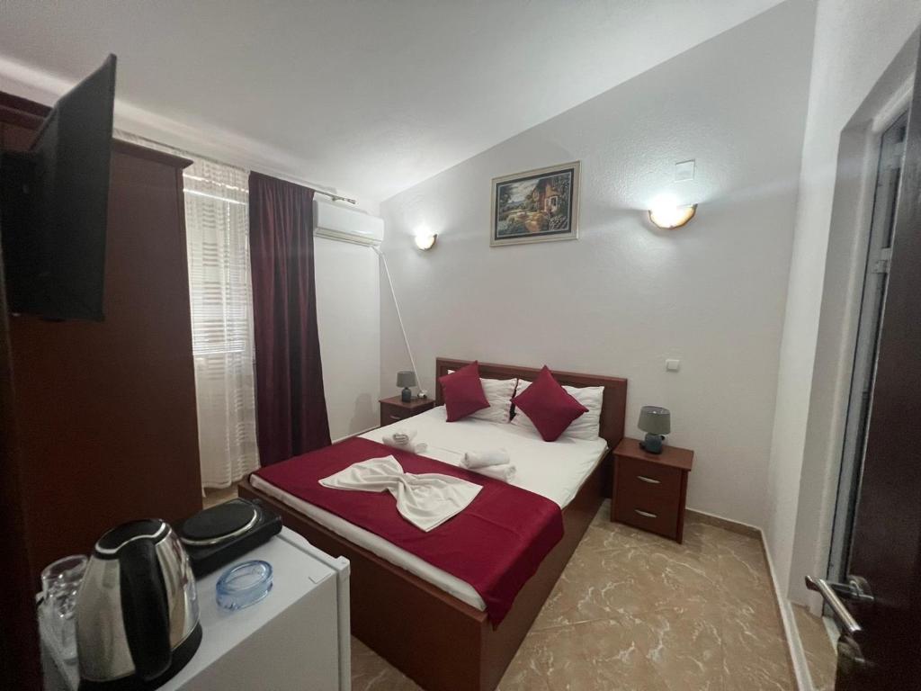 Postel nebo postele na pokoji v ubytování Kasneci Apartments