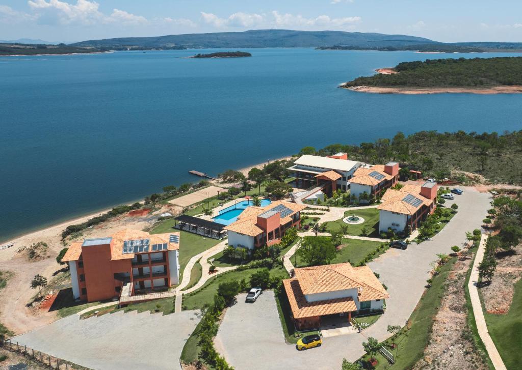 an aerial view of a resort on an island in the water at Riviera Capitólio Hotel in Capitólio