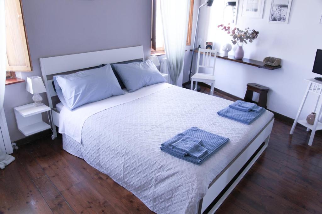Postel nebo postele na pokoji v ubytování CIRIBACCO ROOMS