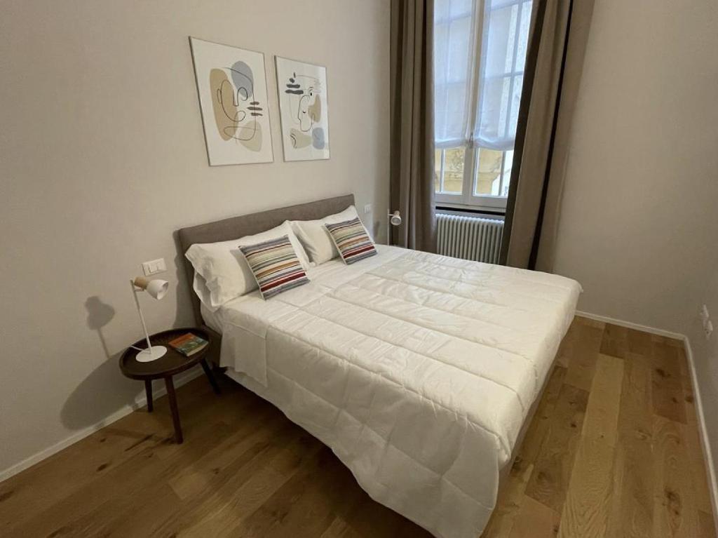 מיטה או מיטות בחדר ב-Pellicceria Guest House