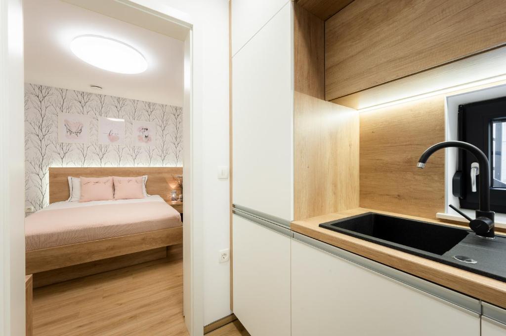 Postel nebo postele na pokoji v ubytování Apartments Gros