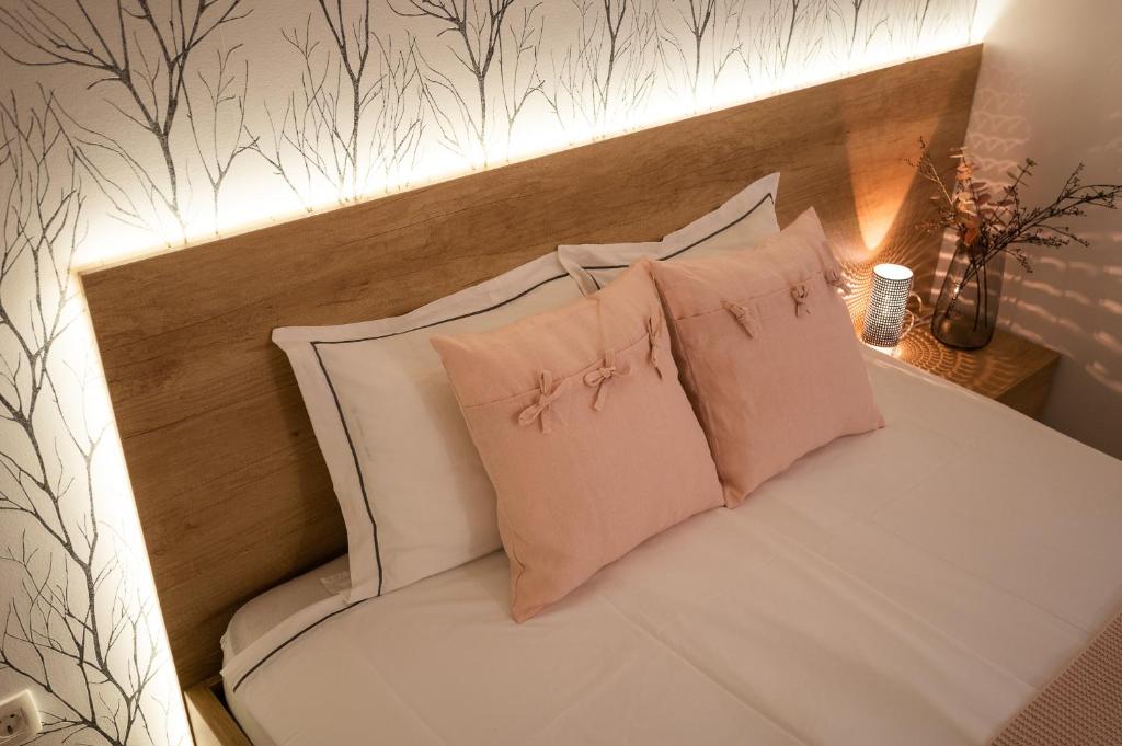 Postel nebo postele na pokoji v ubytování Apartments Gros