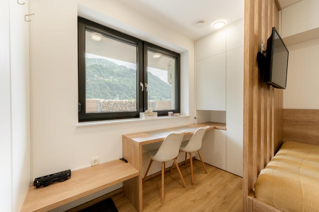 TV a/nebo společenská místnost v ubytování Apartments Gros