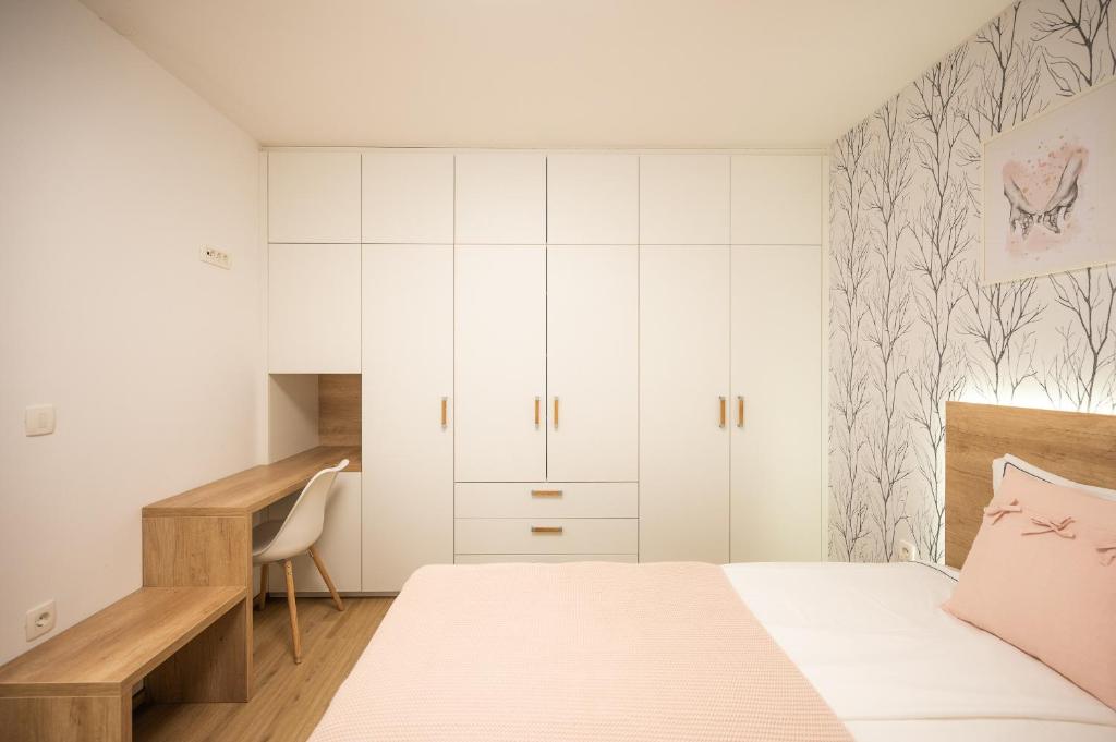 Postel nebo postele na pokoji v ubytování Apartments Gros