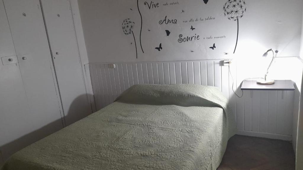 Postel nebo postele na pokoji v ubytování Hospedaje Lorenzo