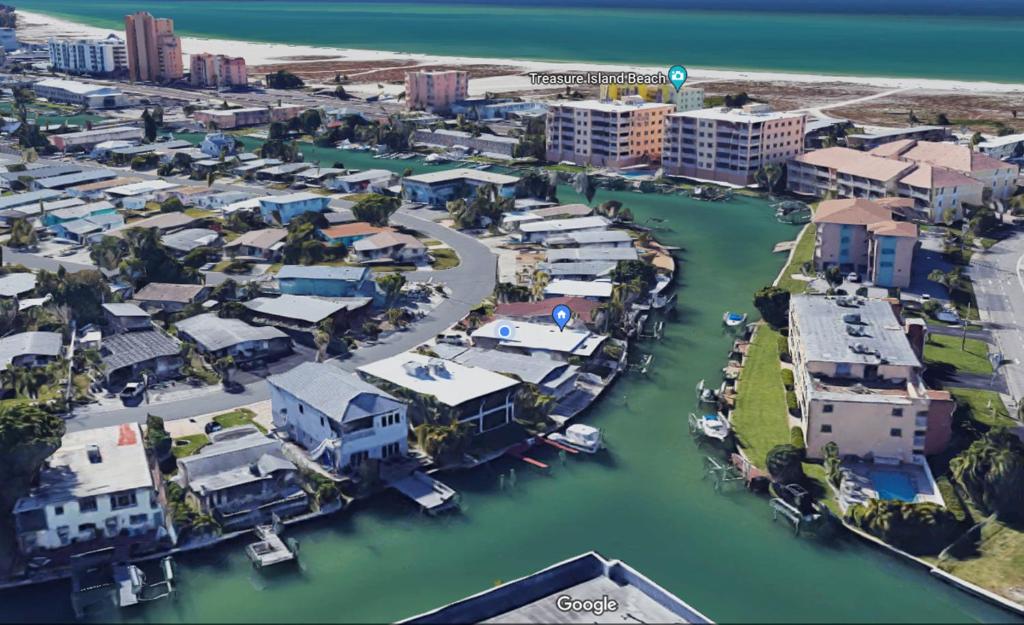 an aerial view of a city with a marina at Waterfront Boat Lift Bungalow in St Pete Beach