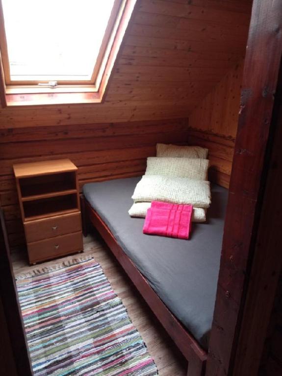 Postel nebo postele na pokoji v ubytování Chatky u Hromádky