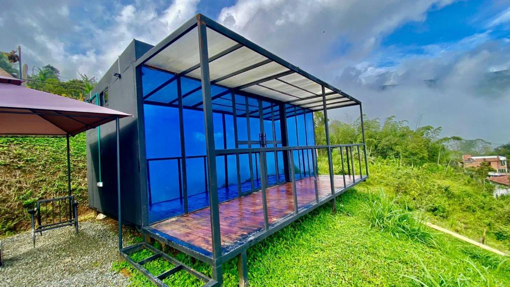 a small blue house on top of a hill at TINY HOME in Copacabana
