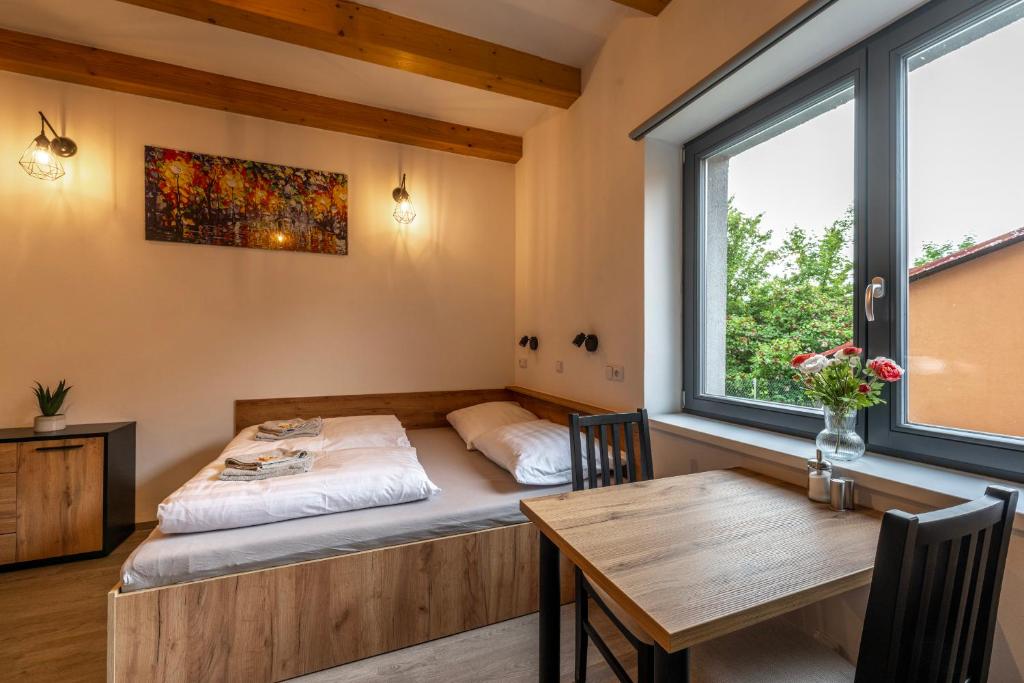 Postel nebo postele na pokoji v ubytování Apartmány Lucie