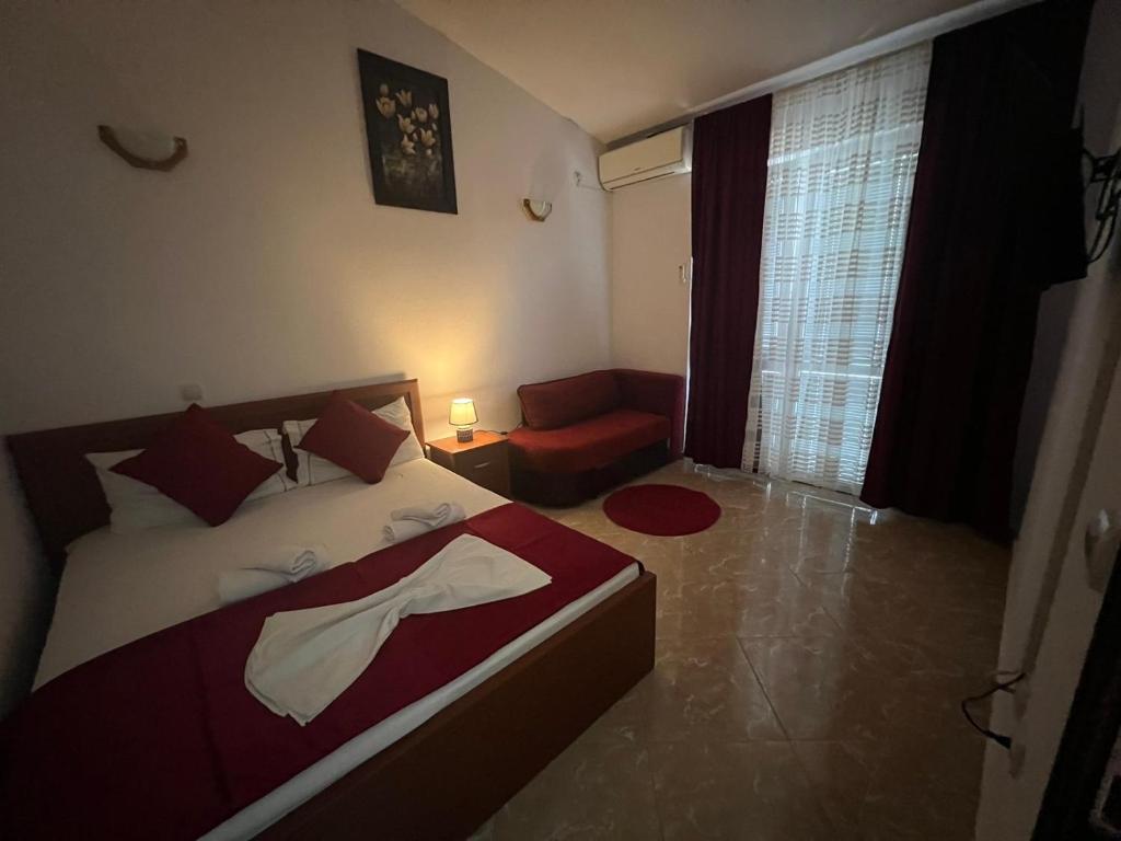 Postel nebo postele na pokoji v ubytování Kasneci Apartments