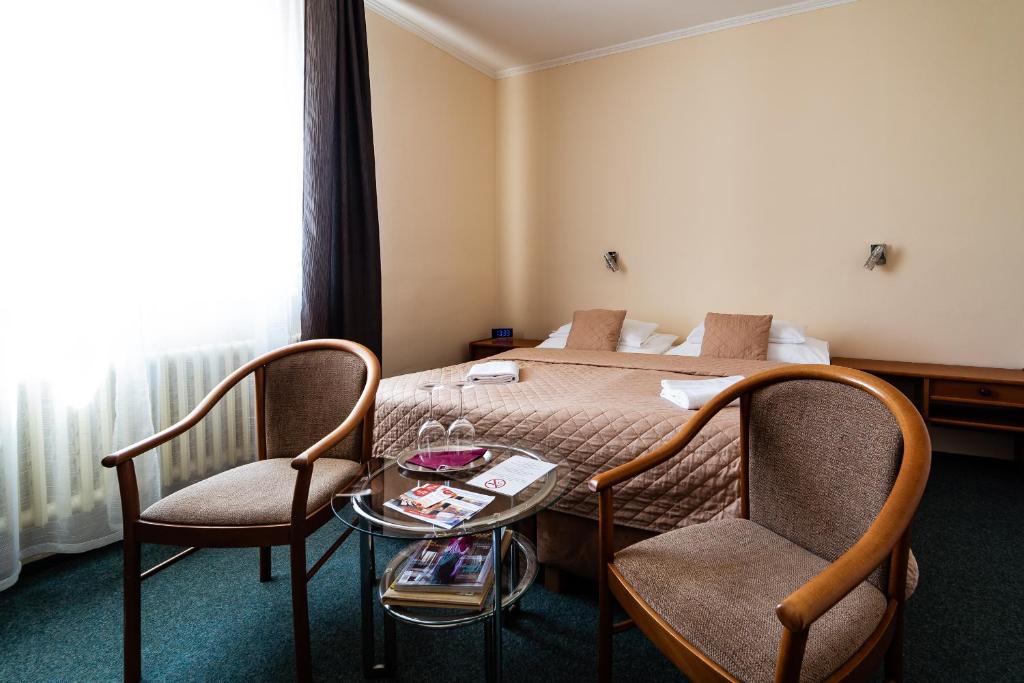 Łóżko lub łóżka w pokoju w obiekcie Hotel Panorama