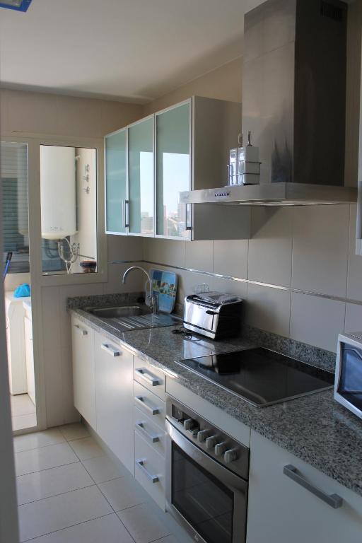 Kuchyň nebo kuchyňský kout v ubytování Apartment Carmentxu Gemelos 26