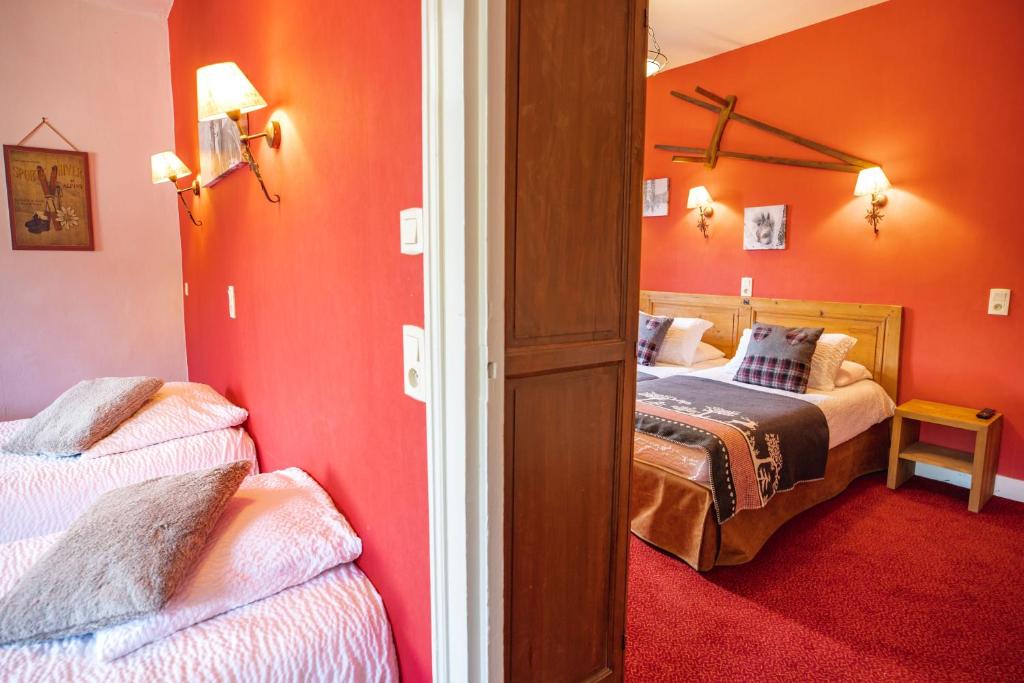 Postel nebo postele na pokoji v ubytování Hôtel Viallet