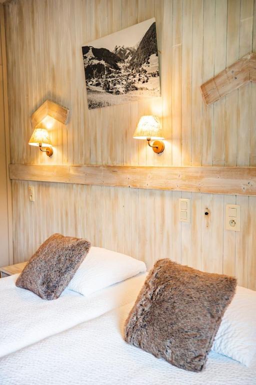 Postel nebo postele na pokoji v ubytování Hôtel Viallet